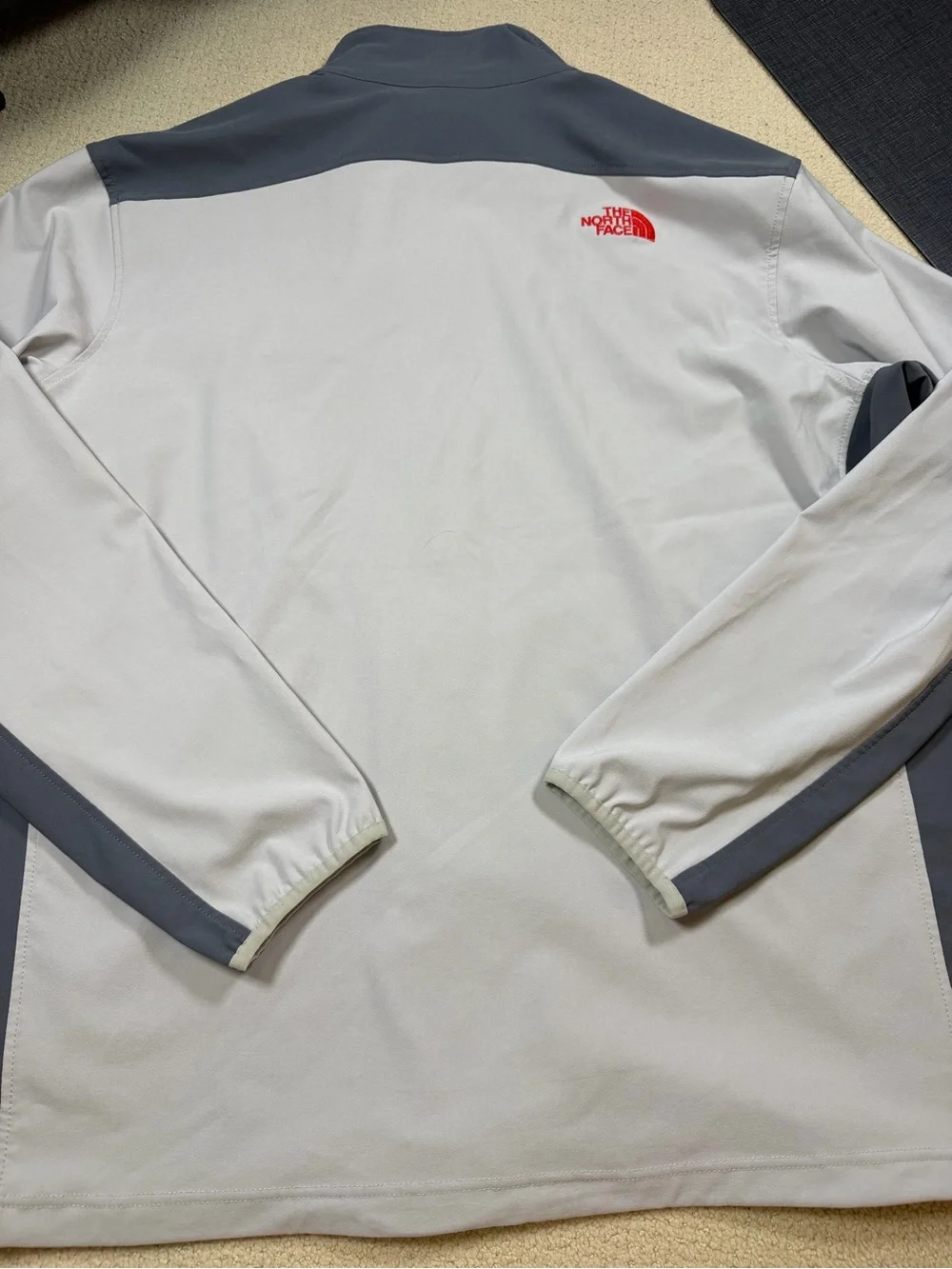 The North Face Men’s Gray Jacket with Red Zipper